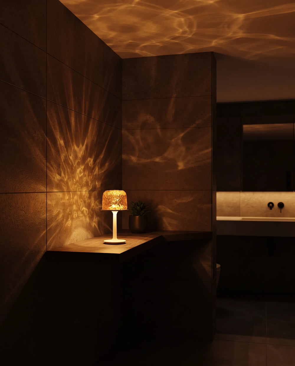 Dark bathroom filled with warm amber light rippling across the walls