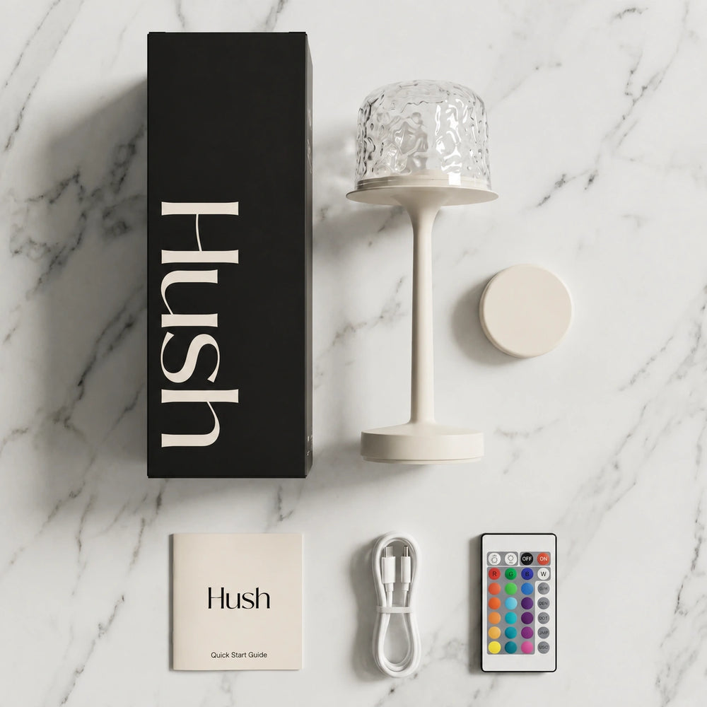 Hush Glow® lamp, dome, remote and USB-C cable laid out